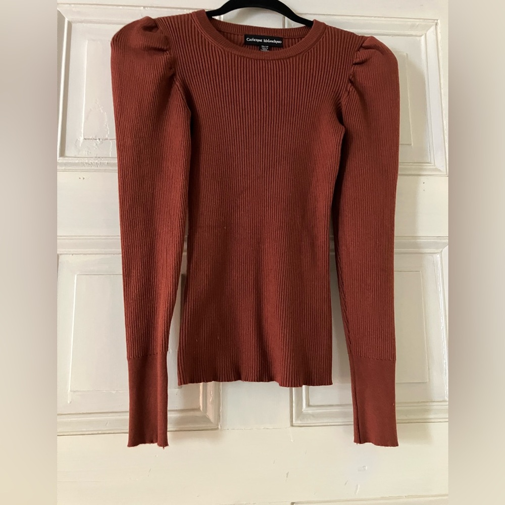 CATHERINE MALANDRINO Puff sleeve sweater. In a rust orange….